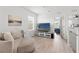 Cozy bonus room with comfortable seating, entertainment center, and bright natural light at 10823 Trailing Vine Dr, Tampa, FL 33610