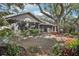 Spacious backyard with screened in porch and mature landscaping at 10902 Bent Tree Pl, Tampa, FL 33618