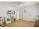 Spacious bedroom with wood-look floors and decor; two closets at 10902 Bent Tree Pl, Tampa, FL 33618