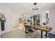Modern dining room with stylish light fixture and views into other living areas at 10902 Bent Tree Pl, Tampa, FL 33618