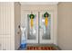 A charming front door, decorated with festive wreaths, that welcomes visitors at 10902 Bent Tree Pl, Tampa, FL 33618