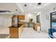 Updated kitchen with stainless steel appliances, kitchen island, and a view of the pool area at 10902 Bent Tree Pl, Tampa, FL 33618