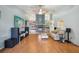 Bright living room featuring hardwood floors, a brick fireplace, and neutral color scheme at 10902 Bent Tree Pl, Tampa, FL 33618