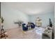 Bright living room with hardwood floors, stylish decor, and a charming arched window at 10902 Bent Tree Pl, Tampa, FL 33618