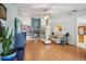 Open concept living room with hardwood floors, a brick fireplace, and neutral color scheme at 10902 Bent Tree Pl, Tampa, FL 33618