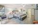Comfortable primary bedroom showcasing wood floors, a seating area, and calming decor at 10902 Bent Tree Pl, Tampa, FL 33618