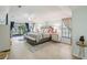 Spacious primary bedroom with access to pool, wood floors, and a sitting area at 10902 Bent Tree Pl, Tampa, FL 33618