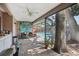 Covered patio with seating and view of the pool and backyard at 10902 Bent Tree Pl, Tampa, FL 33618
