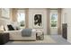 Comfortable bedroom with a queen-size bed, soft bedding, and ample natural light at 11740 E 71St Ave, Palmetto, FL 34221