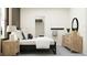 Bright bedroom features a large bed, warm lighting, and a convenient closet at 11740 E 71St Ave, Palmetto, FL 34221