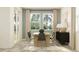 Bright dining area with large windows, modern decor, and stylish furnishings at 11740 E 71St Ave, Palmetto, FL 34221