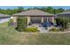 Well-maintained backyard with a screened-in patio and manicured landscaping at 12492 Eastpointe Dr, Dade City, FL 33525