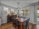 Inviting dining room features a wood table, unique lighting fixture, and stylish decor at 12492 Eastpointe Dr, Dade City, FL 33525