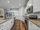 Well-equipped kitchen featuring modern appliances, granite countertops, and ample cabinet space for storage at 12492 Eastpointe Dr, Dade City, FL 33525