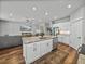 Bright, open kitchen with stainless appliances, a center island, and seamless flow to the living area at 12492 Eastpointe Dr, Dade City, FL 33525