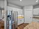Modern kitchen featuring stainless steel appliances, white cabinets, and granite countertops for a stylish and functional space at 12492 Eastpointe Dr, Dade City, FL 33525