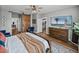 Bright and inviting main bedroom with decor, accent furniture, and a TV at 12492 Eastpointe Dr, Dade City, FL 33525