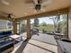 Spacious screened patio with ceiling fans, outdoor seating and views of the backyard at 12492 Eastpointe Dr, Dade City, FL 33525