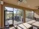 Bright screened patio with ceiling fans, outdoor dining area, and natural lighting at 12492 Eastpointe Dr, Dade City, FL 33525