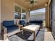 Comfortable screened patio with outdoor seating, ceiling fan, and a bright view at 12492 Eastpointe Dr, Dade City, FL 33525