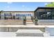 Backyard featuring a boat dock, waterside patio, and screened-in porch, perfect for enjoying the outdoors at 1432 50Th Ne Ave, St Petersburg, FL 33703