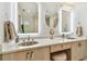 Close up of bathroom vanity with dual sinks and backlit mirrors at 1432 50Th Ne Ave, St Petersburg, FL 33703