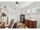 Bright bedroom featuring wood floors, white walls, closet, and modern ceiling fan at 1432 50Th Ne Ave, St Petersburg, FL 33703