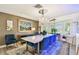 Chandelier highlights formal dining area with stylish furnishings and bay window at 1432 50Th Ne Ave, St Petersburg, FL 33703