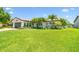 Beautifully landscaped home with mature palms and a spacious lawn at 1432 50Th Ne Ave, St Petersburg, FL 33703
