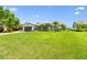 Landscaped home with well-manicured lawn, palms and a brick driveway at 1432 50Th Ne Ave, St Petersburg, FL 33703