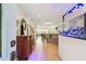 Inviting entryway features an accent cabinet, modern lighting and an aquarium at 1432 50Th Ne Ave, St Petersburg, FL 33703