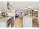 Gourmet kitchen with marble countertops, stainless steel appliances, and an open floor plan at 1432 50Th Ne Ave, St Petersburg, FL 33703