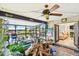 Enclosed lanai with ceiling fan, bar seating, and beautiful waterfront views is perfect for entertaining at 1432 50Th Ne Ave, St Petersburg, FL 33703