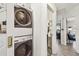 Stacked laundry units with modern fixtures in hallway at 1432 50Th Ne Ave, St Petersburg, FL 33703