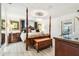 Grand main bedroom features wood accents and a beautiful chandelier at 1432 50Th Ne Ave, St Petersburg, FL 33703