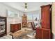 Office space features a ceiling fan, natural light, and zebra print rug at 1432 50Th Ne Ave, St Petersburg, FL 33703