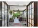 Covered porch with outdoor furniture and decor at 1432 50Th Ne Ave, St Petersburg, FL 33703