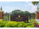 Decorative sign for Swann Pond at Hyde Park Village surrounded by greenery, enhancing the community's charm at 1501 W Horatio St # 101, Tampa, FL 33606