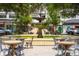 Picturesque fountain surrounded by tables and chairs, creating a relaxing outdoor gathering space at 1501 W Horatio St # 101, Tampa, FL 33606