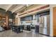 Open kitchen featuring black cabinetry, stainless steel appliances, and center island at 1501 W Horatio St # 101, Tampa, FL 33606