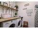 Efficient laundry room featuring a modern washer and dryer, ample counter space, and stylish decor accents at 1501 W Horatio St # 101, Tampa, FL 33606