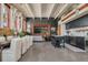 Open living area featuring a kitchen, dining table, living space, and modern lighting at 1501 W Horatio St # 101, Tampa, FL 33606