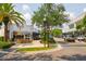 Charming street with Forbici restaurant featuring outdoor seating, palm trees and lush landscaping at 1501 W Horatio St # 101, Tampa, FL 33606