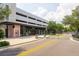 Commercial building featuring sidewalk and various boutiques, with nearby garage and street access at 1501 W Horatio St # 101, Tampa, FL 33606