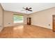 This bedroom offers a ceiling fan, hard flooring, and natural light at 15234 Scanio Dr, Spring Hill, FL 34610