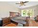 This spacious bedroom is equipped with hard flooring and natural light at 15234 Scanio Dr, Spring Hill, FL 34610