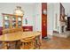 Cozy dining room adjacent to a fireplace, featuring a wooden table and chairs at 15234 Scanio Dr, Spring Hill, FL 34610