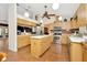 Spacious kitchen equipped with stainless steel appliances, wood cabinets and island, great for cooking and entertaining at 15234 Scanio Dr, Spring Hill, FL 34610