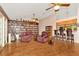 Inviting living room featuring a full wall bookcase and a bar area at 15234 Scanio Dr, Spring Hill, FL 34610