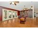 Spacious room with access to the backyard and a wall bookcase perfect for entertaining at 15234 Scanio Dr, Spring Hill, FL 34610
